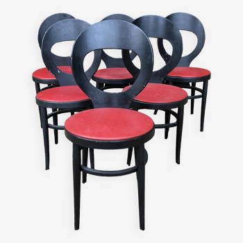 6 chaises vintage Baumann modèle mouette laquées noires à assises en Skaï rouge.