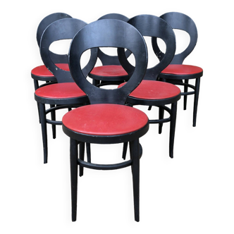6 chaises vintage Baumann modèle mouette laquées noires à assises en Skaï rouge.