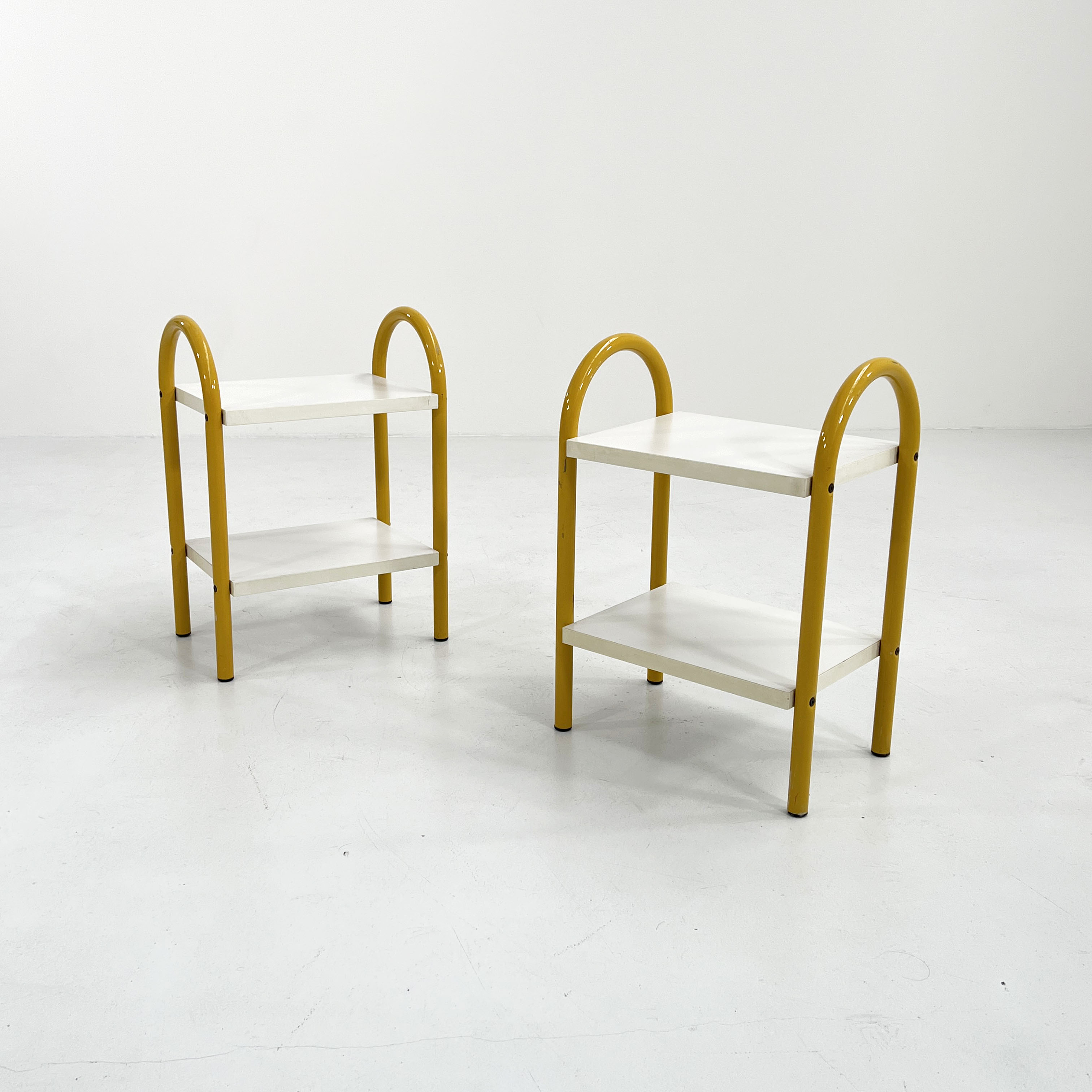Pair of yellow tubular bedside tables, 1980