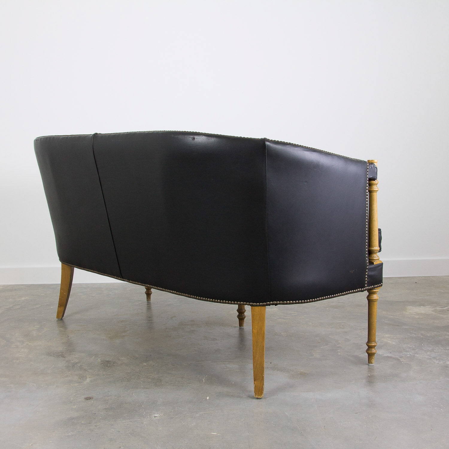 Black leather club sofa