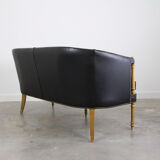 Black leather club sofa