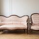 Living room set: Louis XV sofa and armchair in wood and pink fabric.