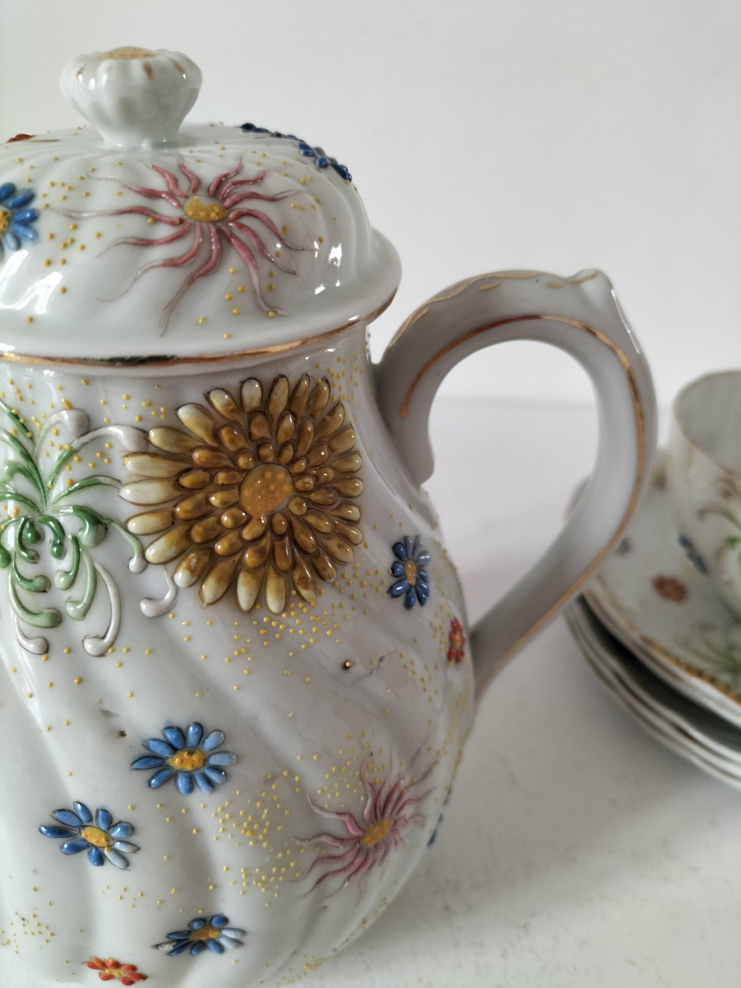 coffee pot, cup and saucers