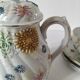 coffee pot, cup and saucers