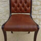 Chic Vintage Chesterfield style chair with wooden frame and faux leather