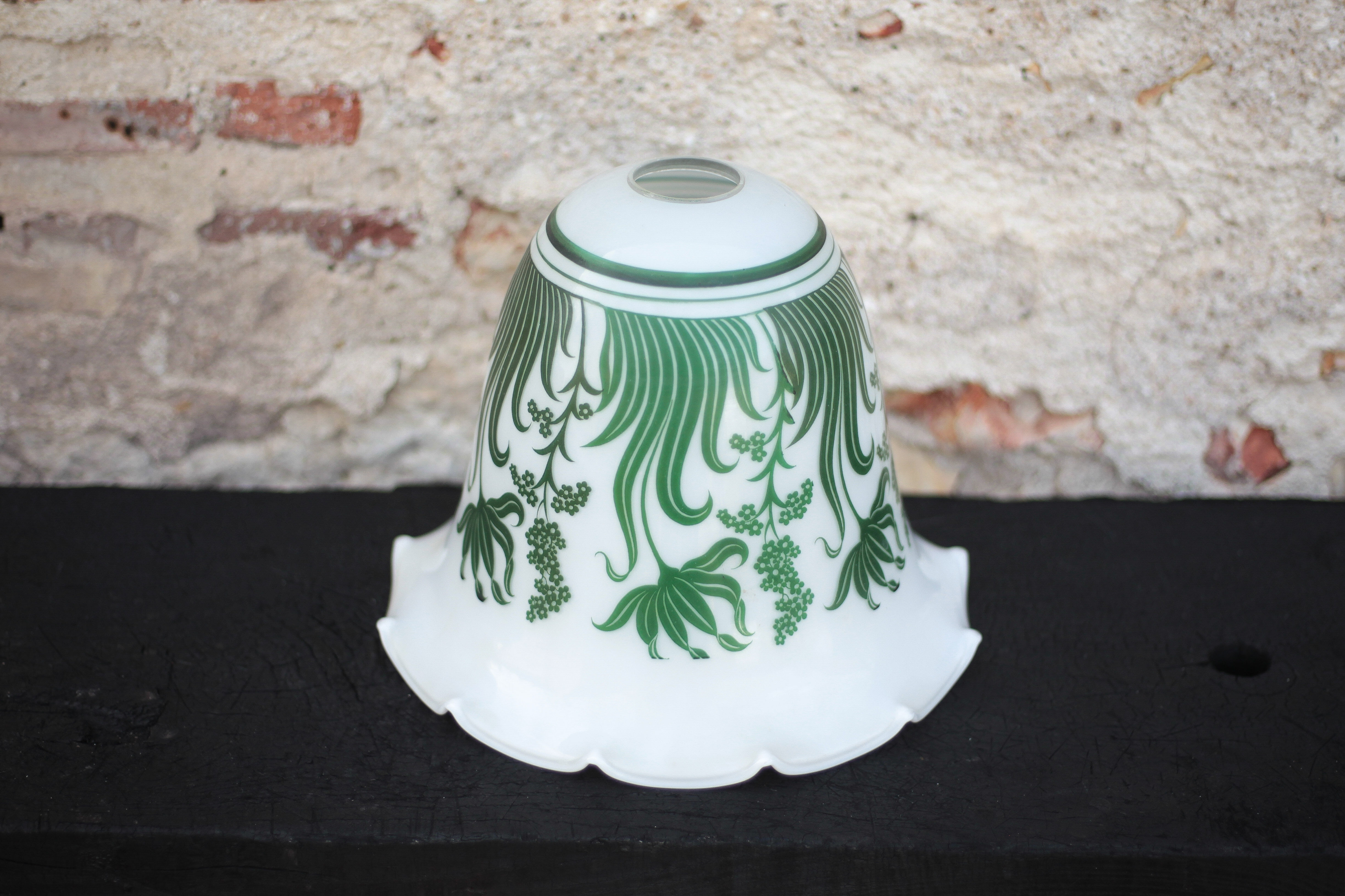 Opaline globe with green flower patterns, bell-shaped lampshade with a corolla.