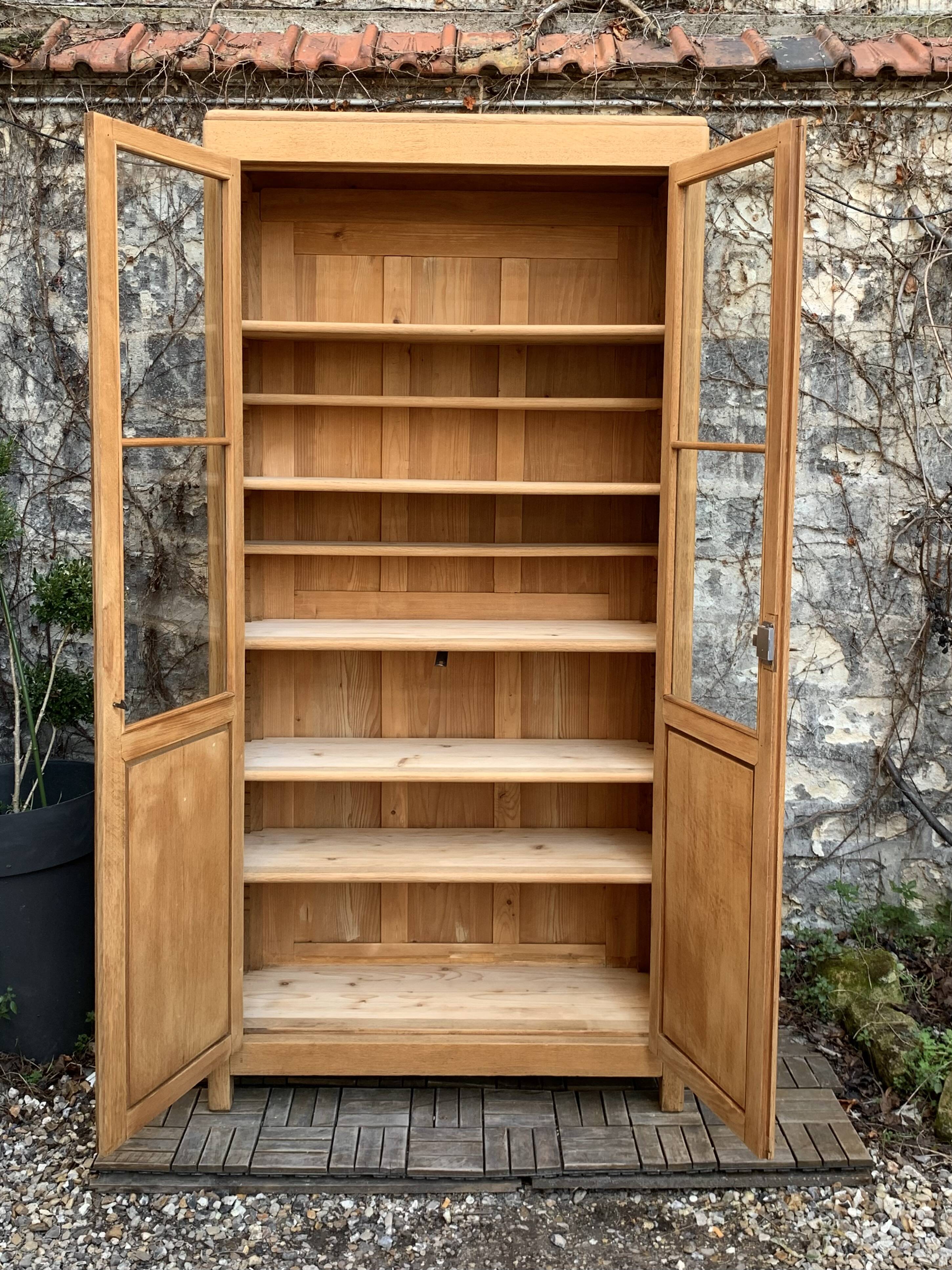 Parisian glass cabinet in solid raw oak, 1950