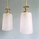 Pair of brass and cracked glass pendants, 1950-60.