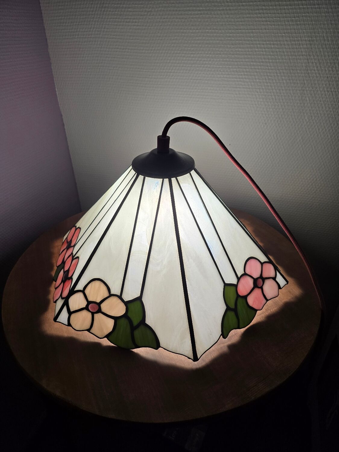 Tiffany-style stained glass lampshade with floral motifs.
