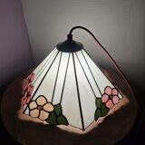 Tiffany-style stained glass lampshade with floral motifs.