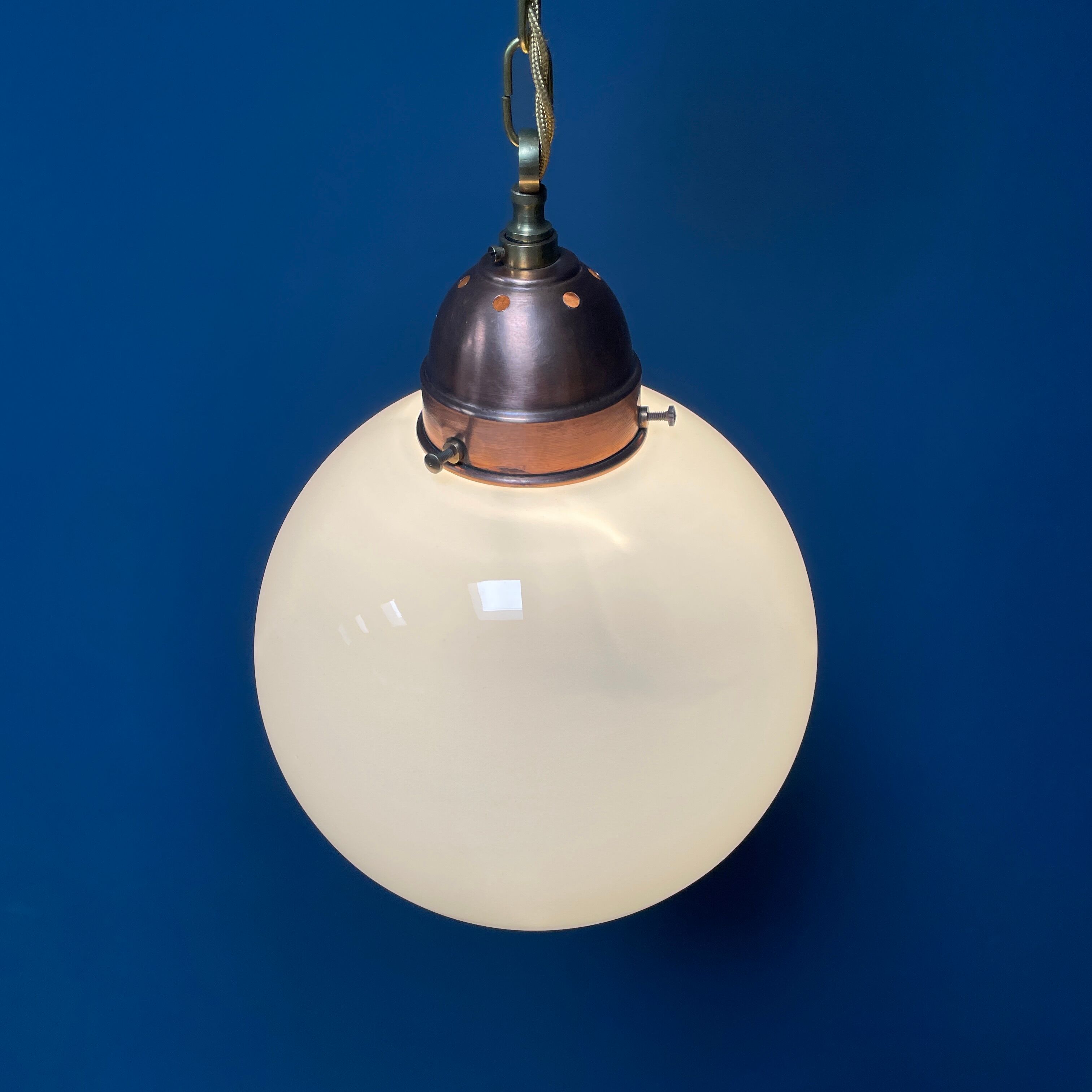 Opaline glass ball hanging lamp with copper fixture