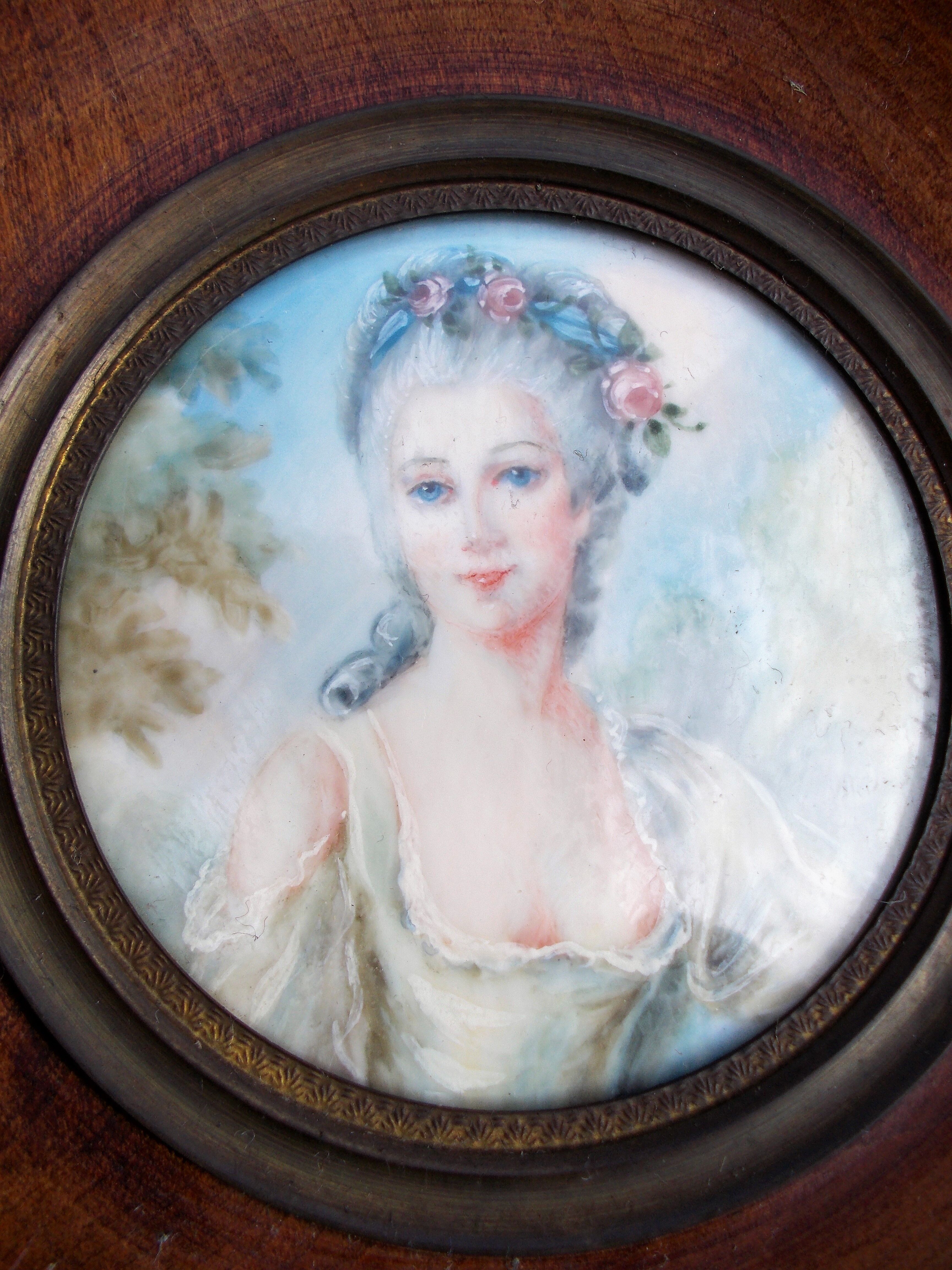 Miniature hand-painted portrait of a woman signed