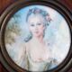Miniature hand-painted portrait of a woman signed