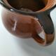 Glazed earthenware pitcher signed HR with a design of stylised birds.