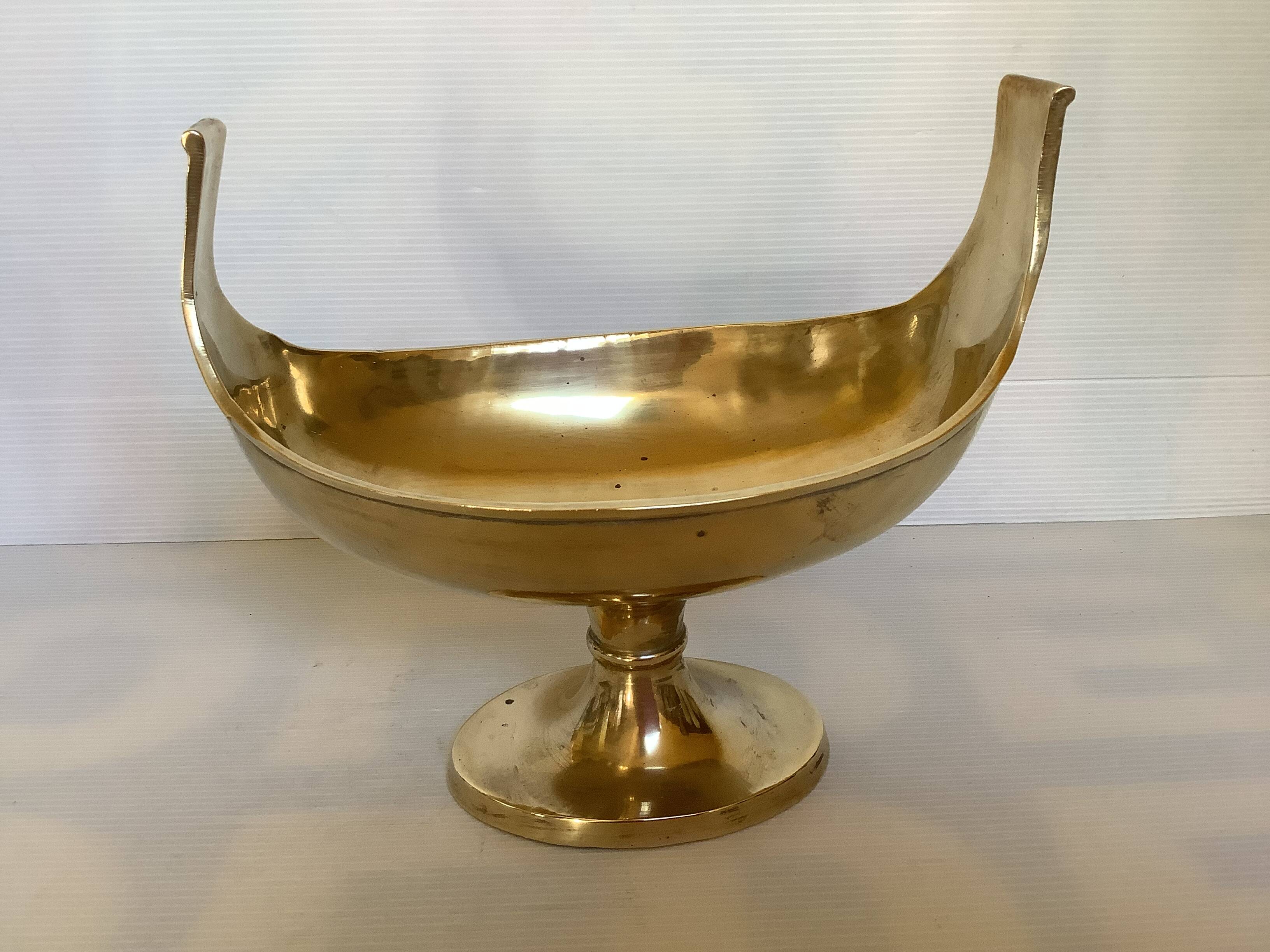 Brass cup emptier