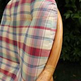 Swivel rattan armchair with matching ottoman