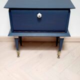 Old bedside table with compass feet