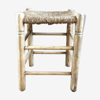 Ancient wooden stool and sea grass