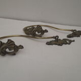 Pair of embraces in numerotée solid brass, rocaille style