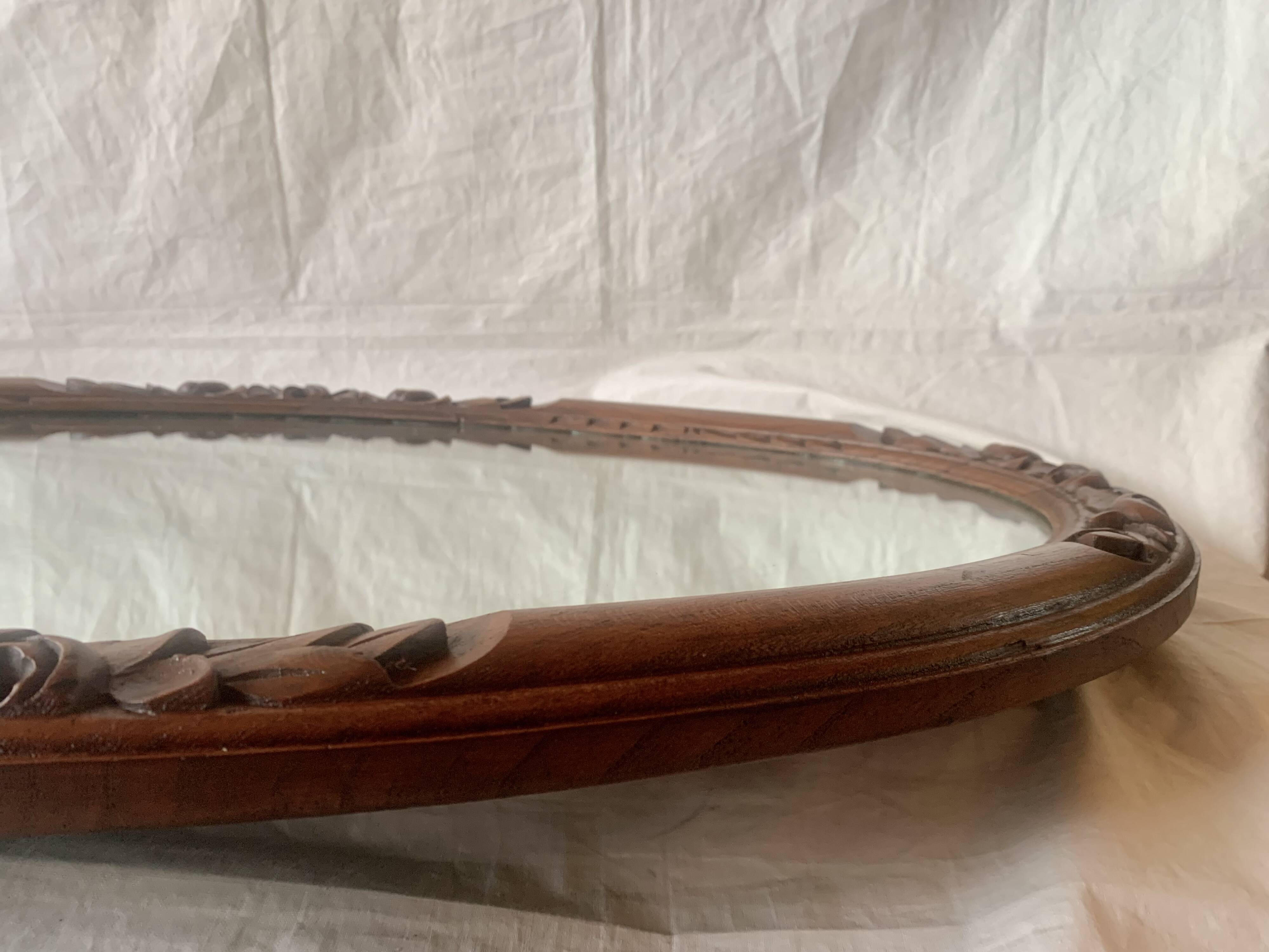 Large Art Deco oval mirror in carved wood - 87 x 53 cm