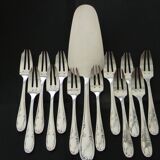 12 cake forks and a silver metal server.