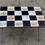 Vintage coffee table with black wrought iron and white tiles.