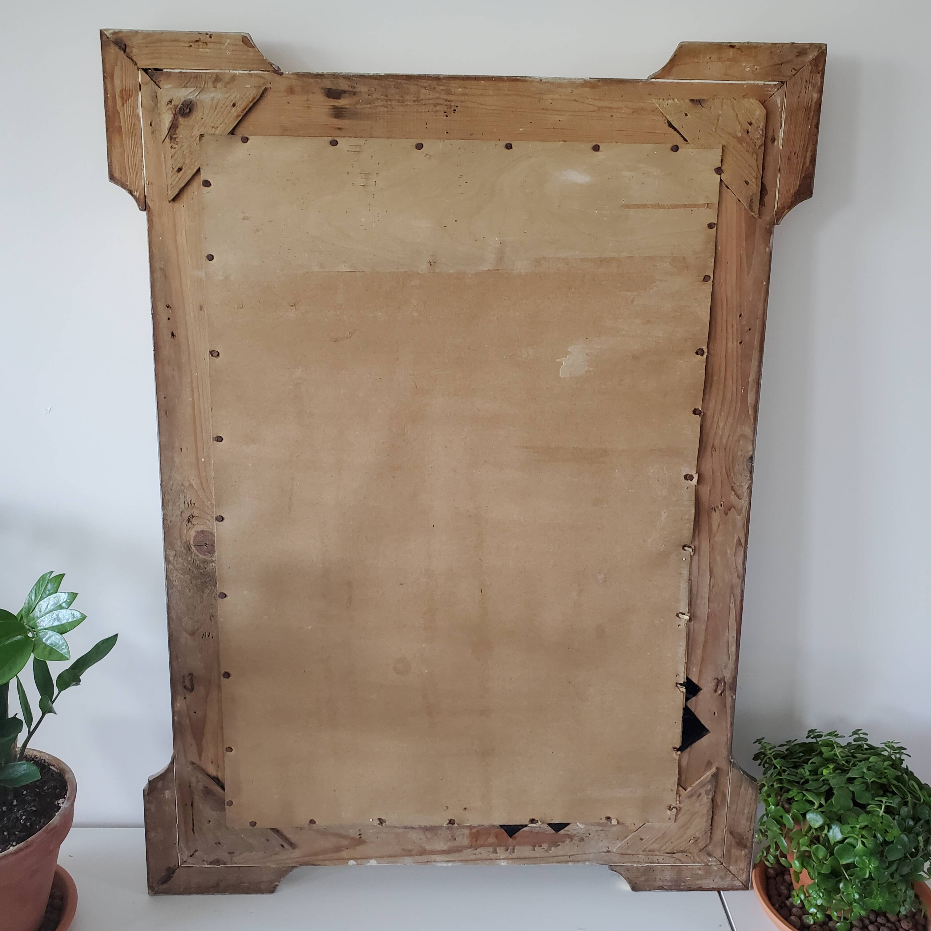 Antique mirror with gilded wood crests