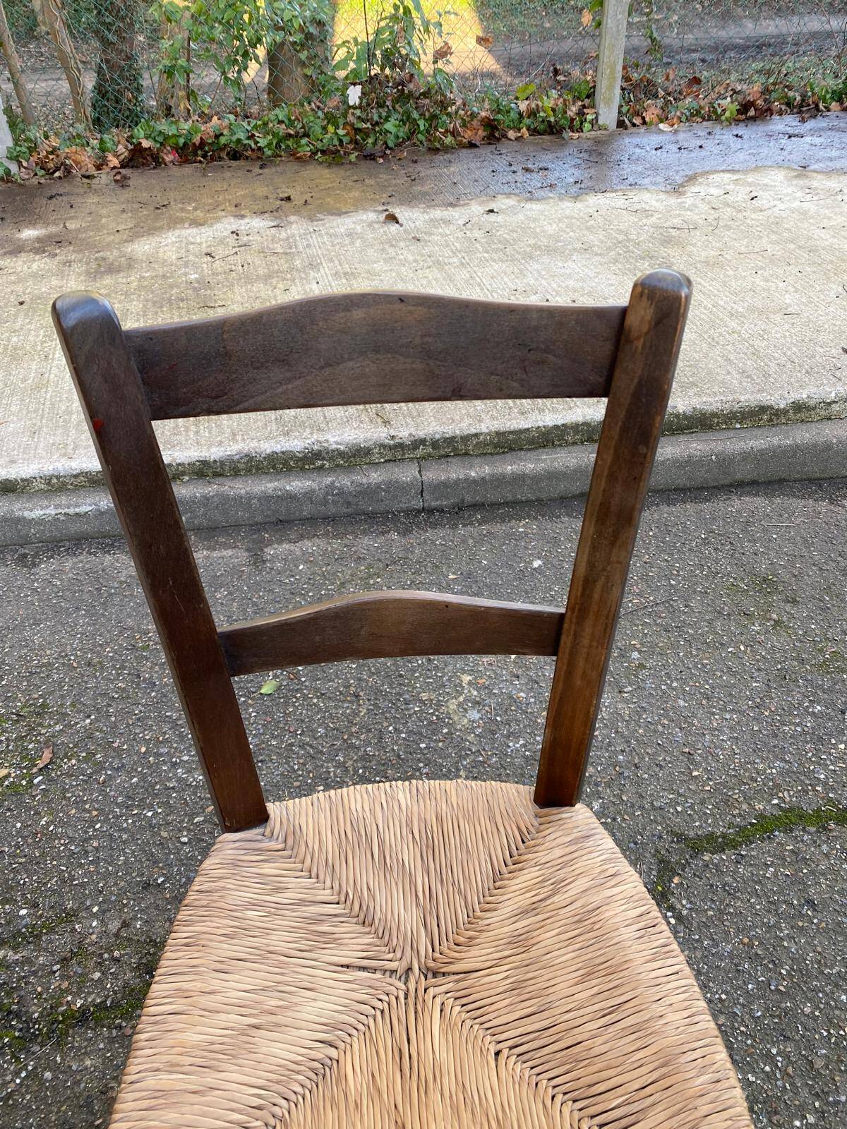 Solid wood chair in dark oak with rush seating, Louis Philippe style.