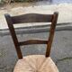 Solid wood chair in dark oak with rush seating, Louis Philippe style.