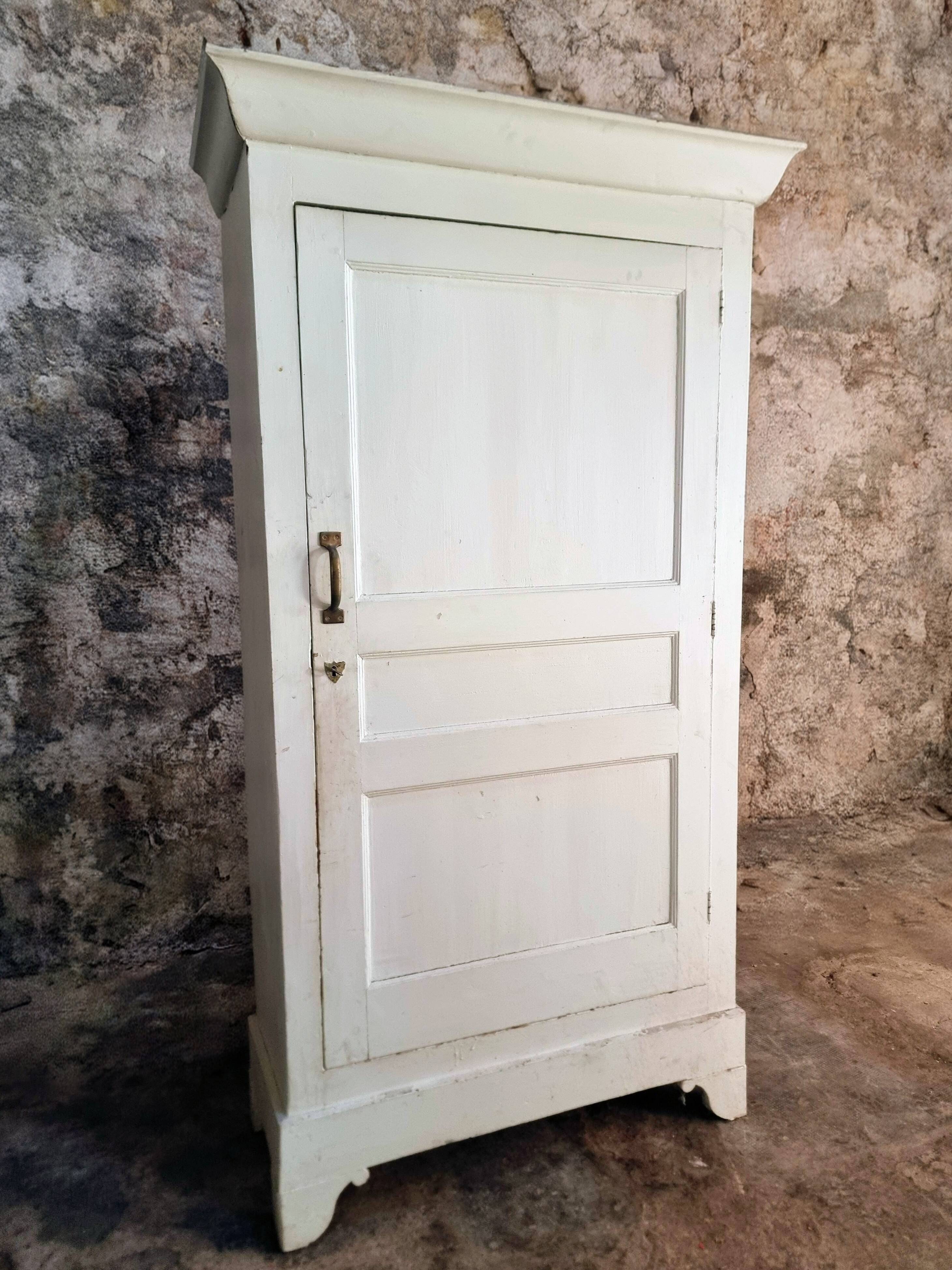 Antique French pine wardrobe with original white paint, circa 1900–1920.