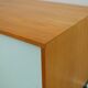 A vintage mid-century wall hung oak cabinet, green & white glass doors