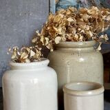 Set of three pots with old condiments in glazed earth