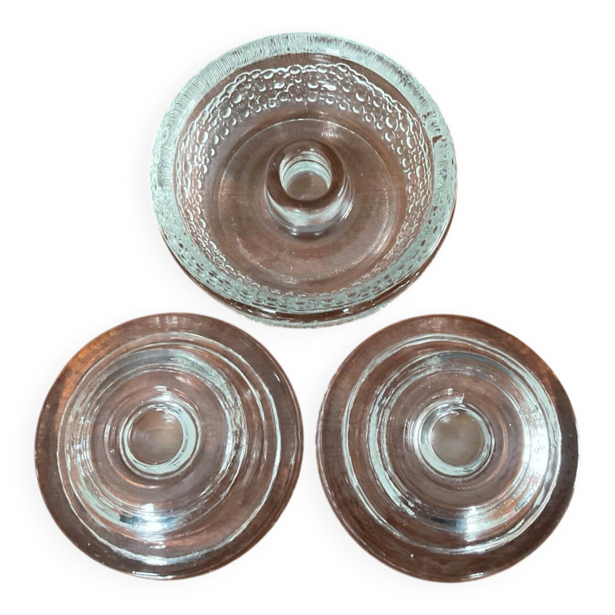 Set of three round thick moulded glass candle holders