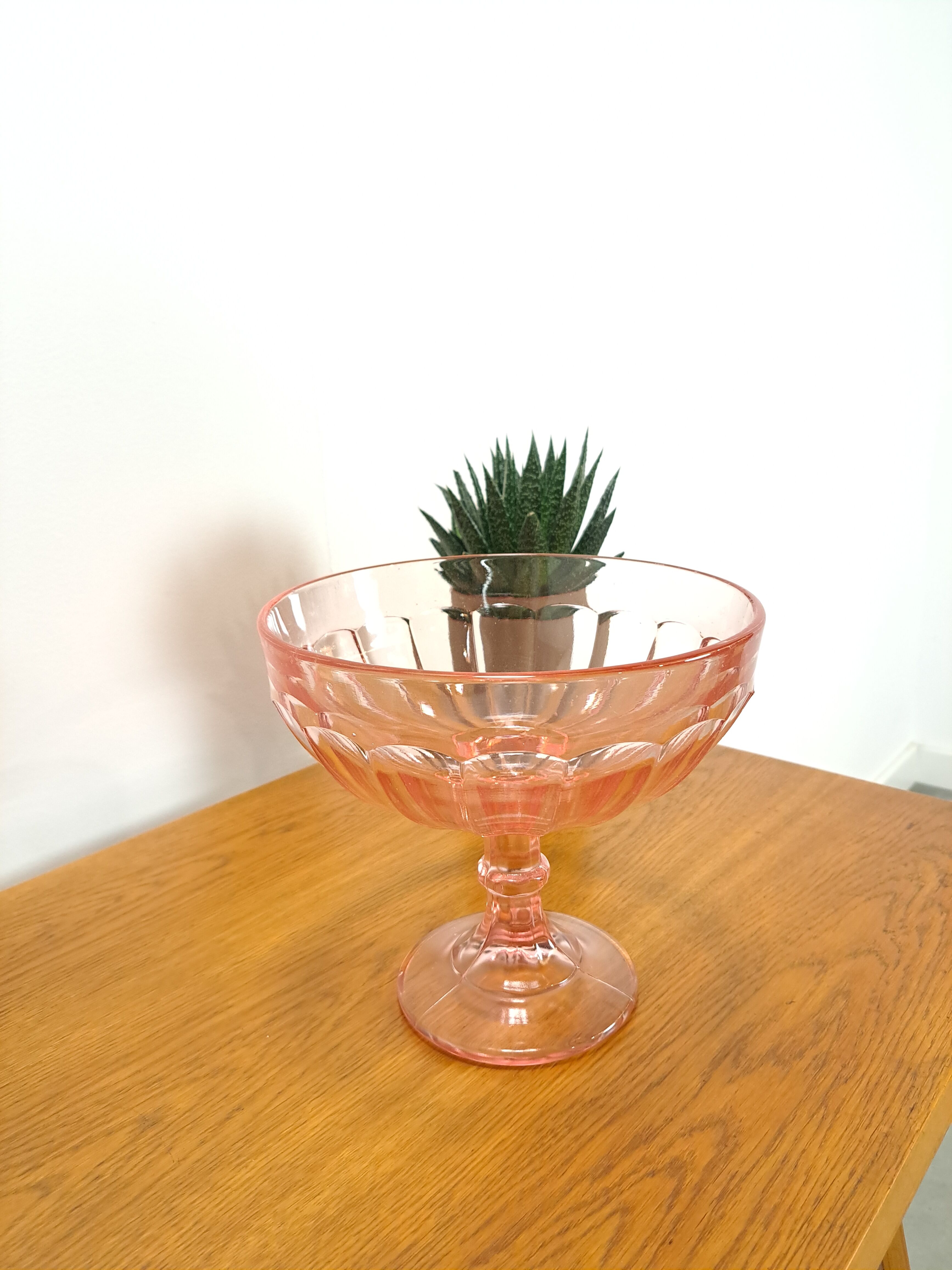 Pink glass bowl on base vintage
