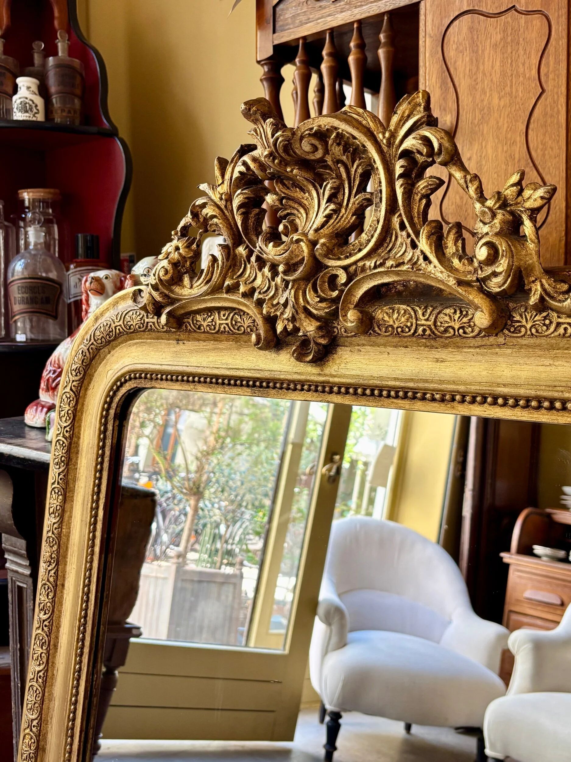 Gold sculpted and moulded stucco trumeau mirror 113 x 78 cm