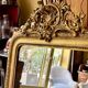 Gold sculpted and moulded stucco trumeau mirror 113 x 78 cm