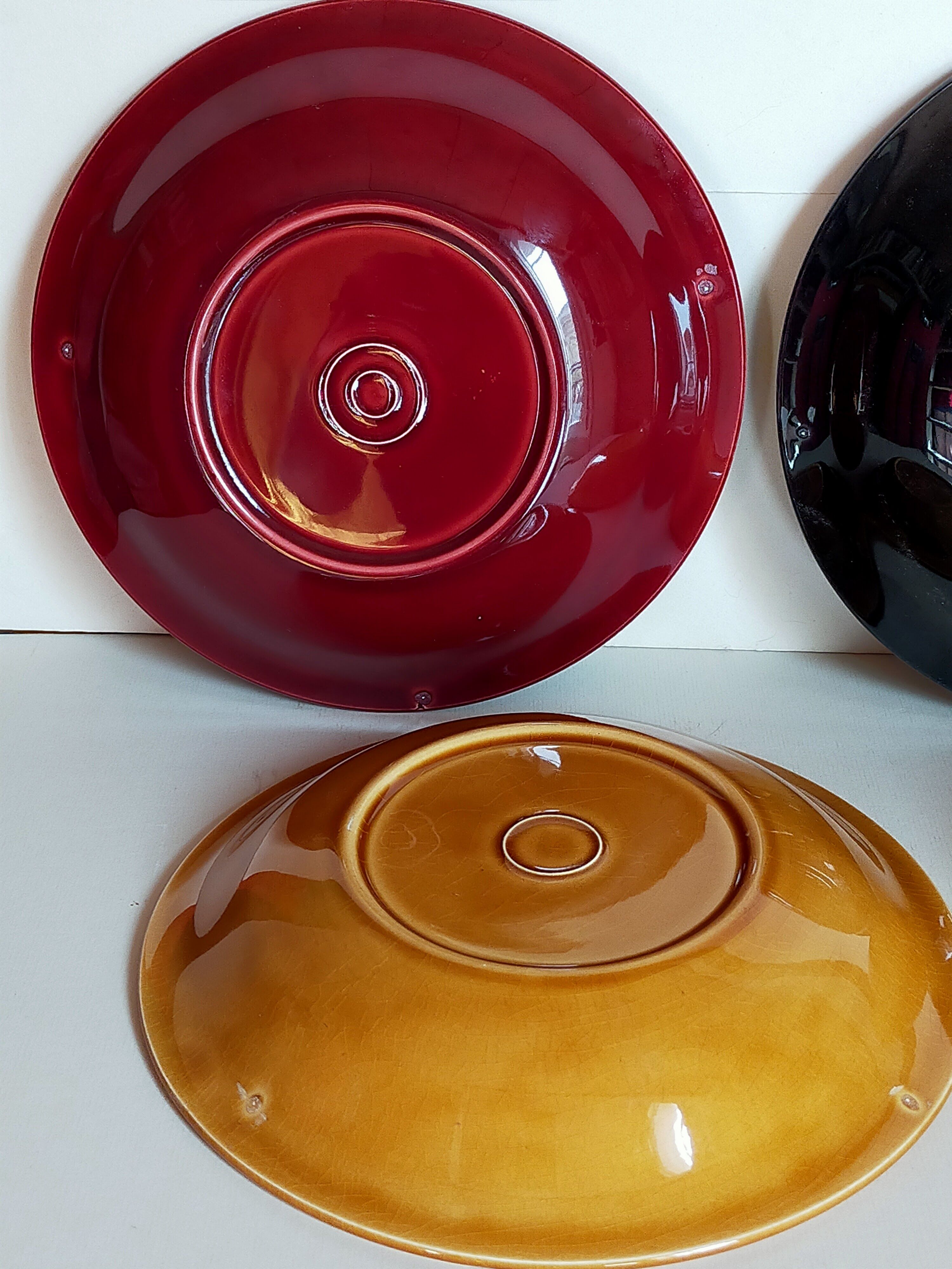 Four multicolored soup plates from the 1950s
