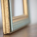 Frame in gilded and green wood