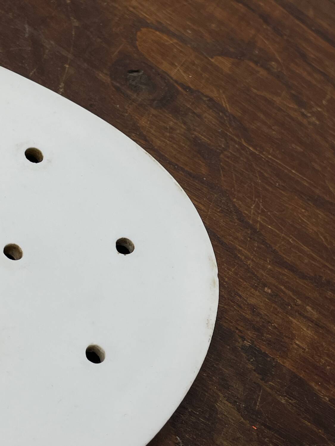 Old iron clay draining plate