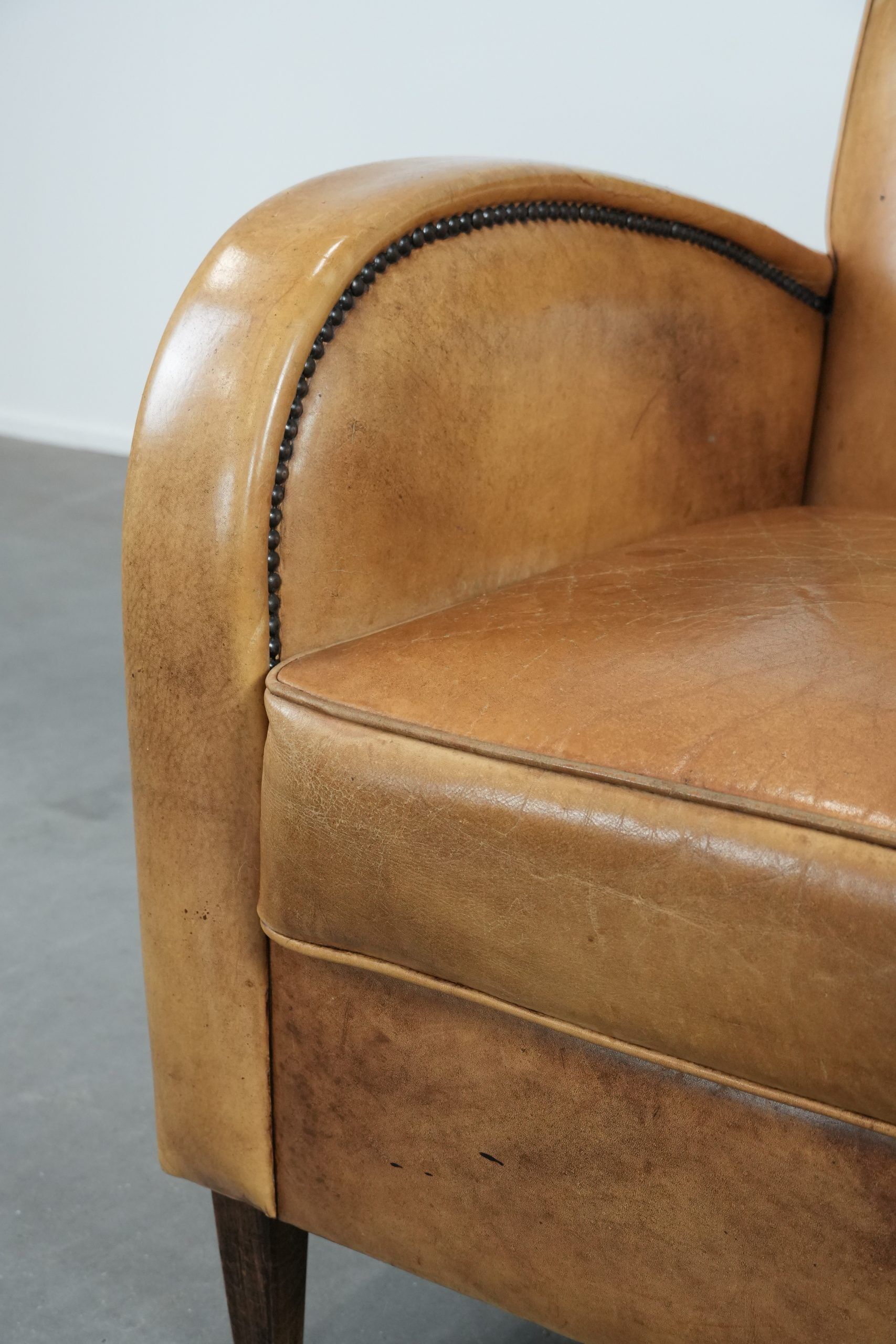 Luxury armchair made of cowhide leather with a beautiful warm colour scheme