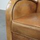 Luxury armchair made of cowhide leather with a beautiful warm colour scheme