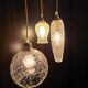 Suspension with three cut glass globes and a diamond tip.