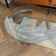 70s design oval coffee table in glass with chrome legs.