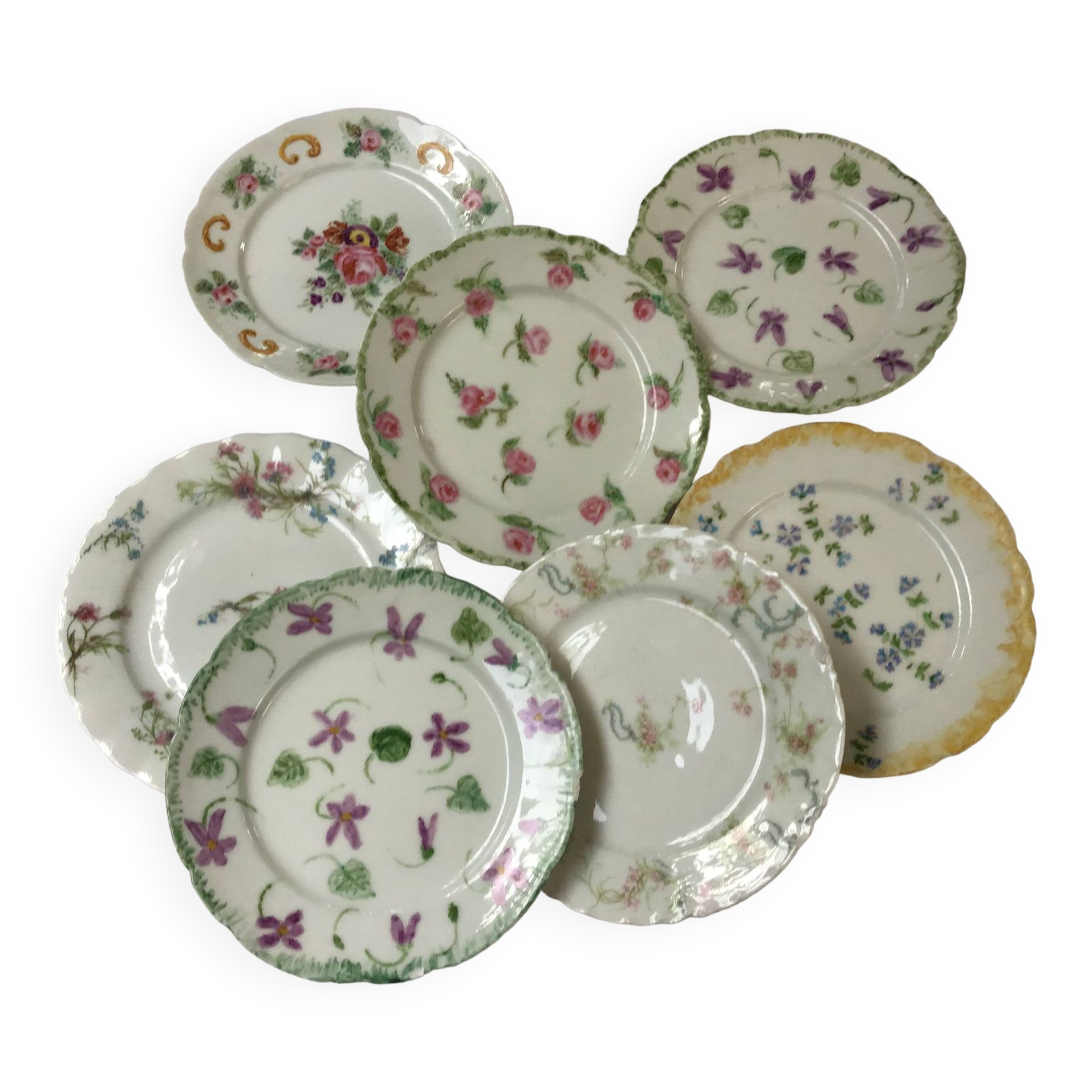 7 small plates in fine Limoges porcelain