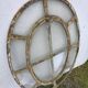 Bull's-eye window from the 19th century in iron (with opening).