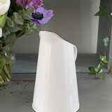Old white enameled pitcher