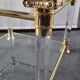 Pair of tables in brass, acrylic and glass