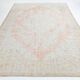 Tapis de salon persan rouge pâle