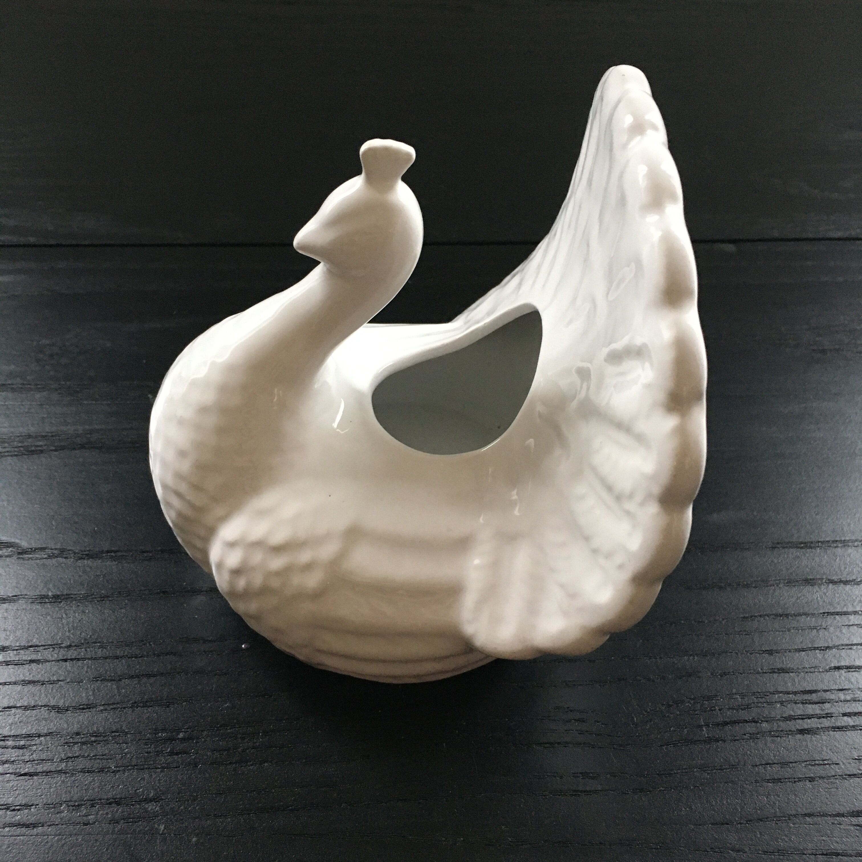 White peacock vase
