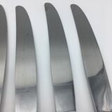 12 silver metal knives.